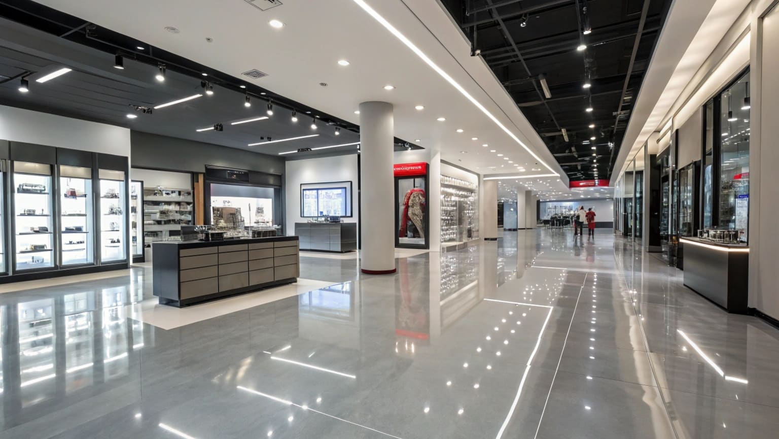 Commercial epoxy flooring installation in Kawana Waters retail space showing glossy gray finish