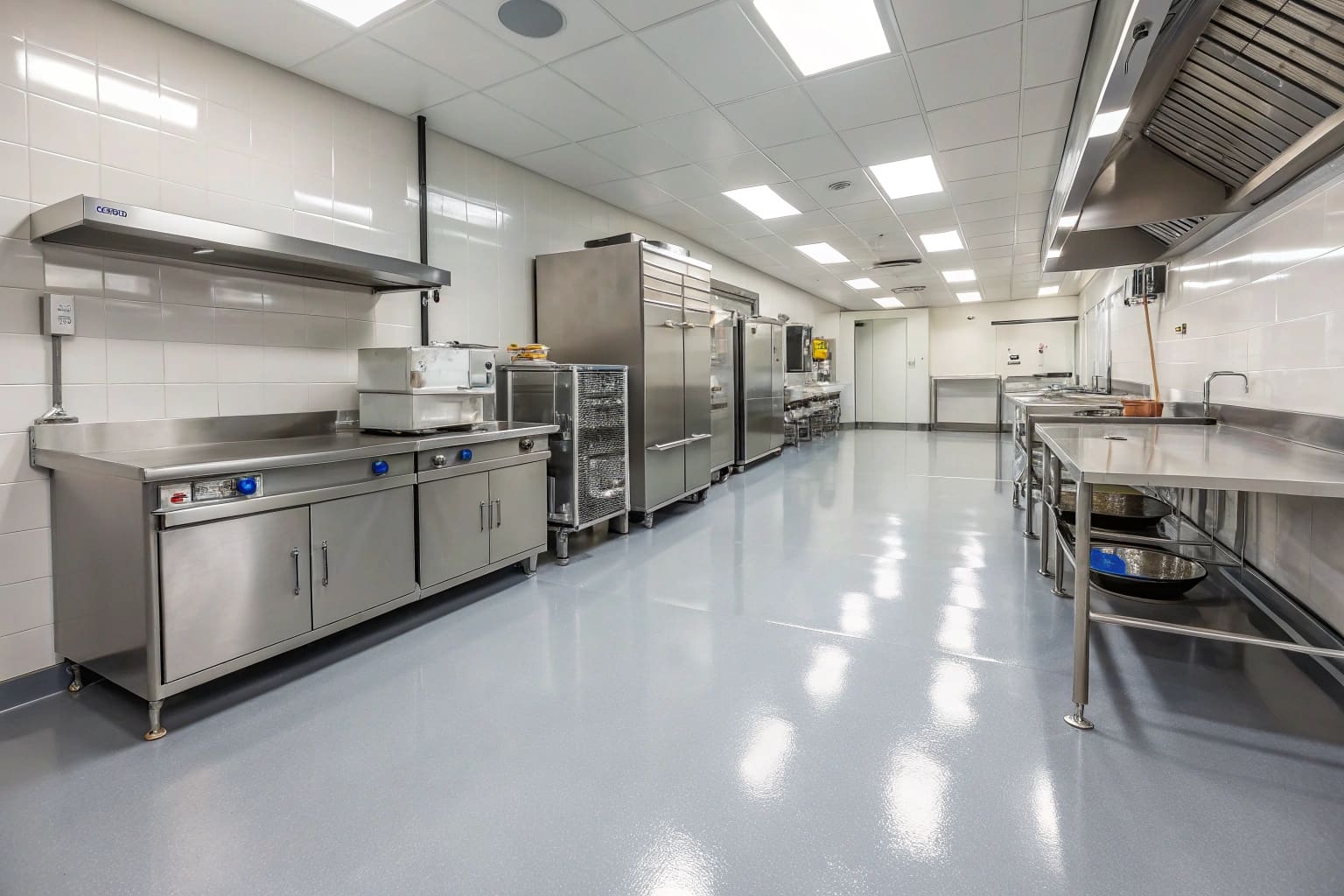 Clean commercial kitchen featuring food-grade epoxy flooring installation by Sunshine Coast specialists