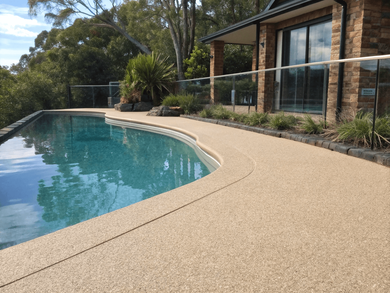 Textured non-slip epoxy pool deck coating colour-matched to pool coping, Sunshine Coast